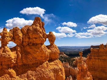 Panoramic view of rock formations against sky