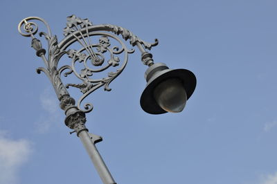 Low angle view of street light against sky