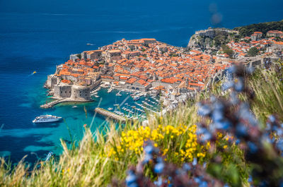 High angle view of townscape by sea