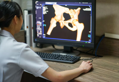 Low angle view of man working on table