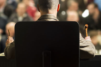 Rear view of businessman sitting on chair