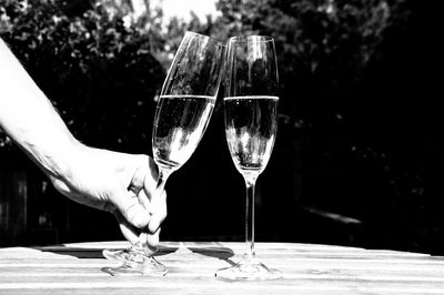 Cropped hand holding champagne flute