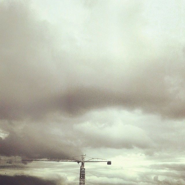 sky, cloud - sky, cloudy, weather, low angle view, overcast, nature, tranquility, cloud, technology, beauty in nature, street light, storm cloud, scenics, outdoors, day, cloudscape, tranquil scene, no people, fuel and power generation