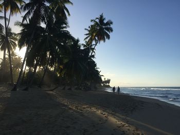 Scenic view of beach against sky during sunset