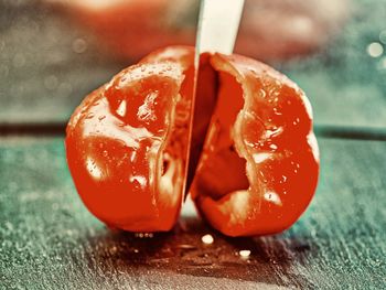 Close-up of orange juice on table