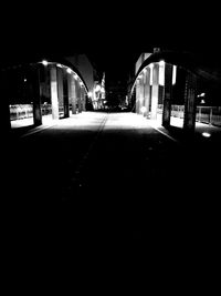 Illuminated bridge at night