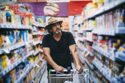 Senior man shopping in a supermarket