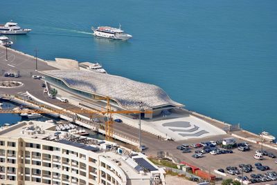 High angle view of city by sea