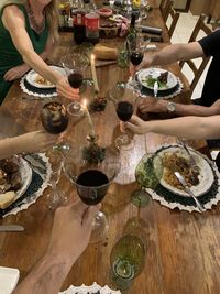 High angle view of people in glass on table