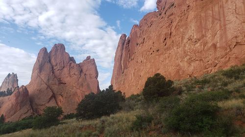 Rock formations on landscape against sky