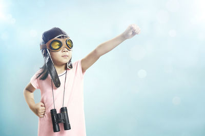 Girl wearing eyewear against sky