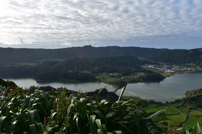 Scenic twin lakes of sete cidades under thick clouds.