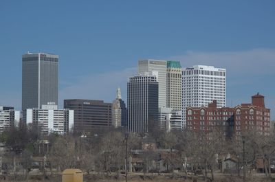 Modern buildings in city against clear sky