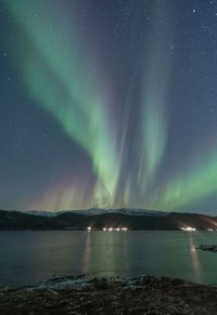 Scenic view of sea against sky at night