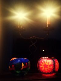 Close-up of illuminated pumpkin on table