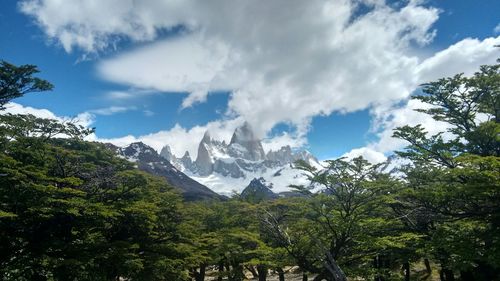 Low angle view of mountains against cloudy sky