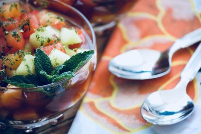 Close-up of fruits in glass bowl on table