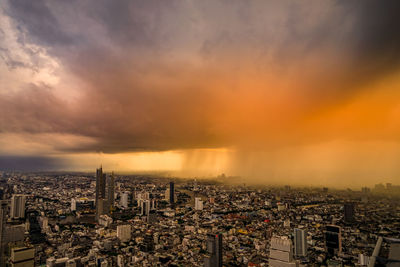 High angle view of cityscape against sky during sunset