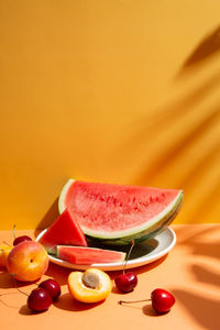 High angle view of fruits in plate on table