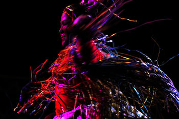 LOW ANGLE VIEW OF MULTI COLORED LIGHT AGAINST BLACK BACKGROUND