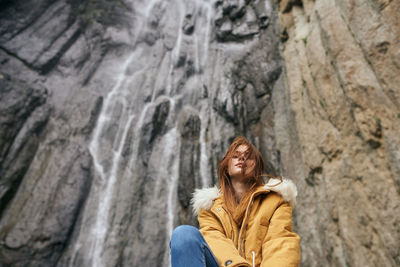 Woman standing on rock