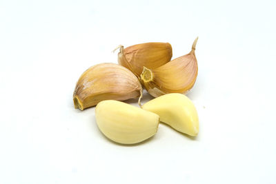 Close-up of garlic against white background