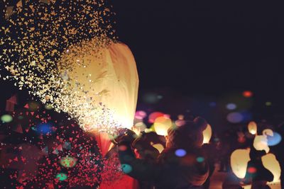 Close-up of illuminated lights against blurred background
