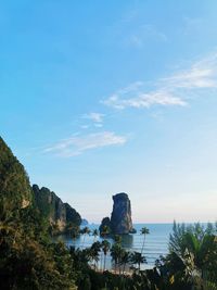 Rock formations in sea against sky