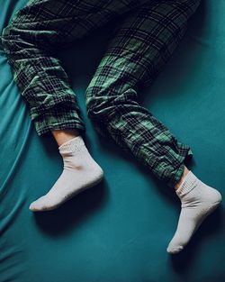 Low section of  sleeping legs with socks 