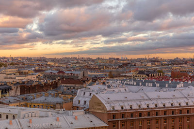 High angle shot of townscape against sky at sunset