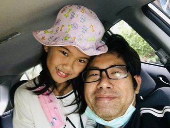 Portrait of happy woman in car