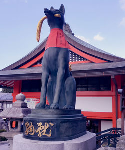 Low angle view of statue against building