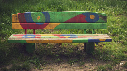 Empty bench on field