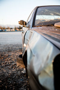 Close-up of car against sky