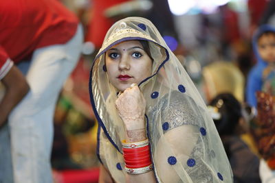 Close-up portrait of woman in sari