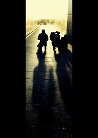Silhouette people walking in bus