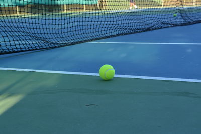 High angle view of tennis ball on sports court
