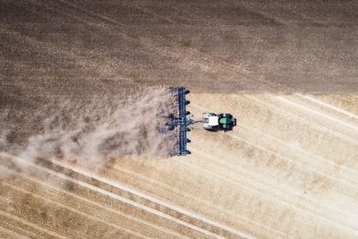 High angle view of combine harvester on agricultural field