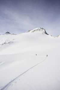 Scenic view of snow covered mountain against sky