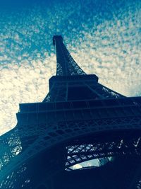 Low angle view of tower against cloudy sky