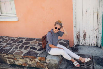 Young woman sitting outdoors