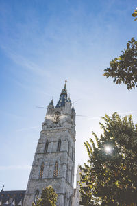 Low angle view of clock tower against sky