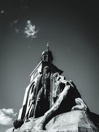 Low angle view of statue of building against sky