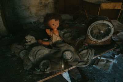 High angle view of abandoned doll on table 