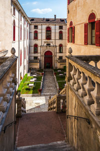 Staircase of old building in city against sky