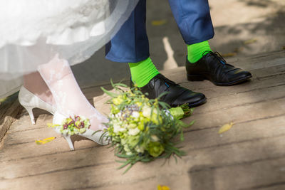 Low section of woman wearing shoes