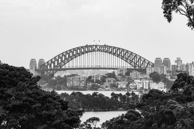 View of bridge and buildings against sky