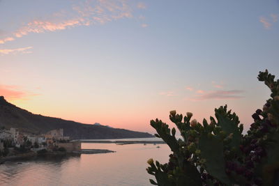 Scenic view of lake at sunset