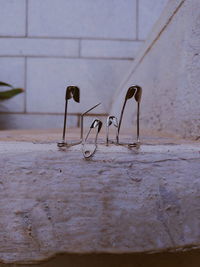 Close-up of empty table against wall