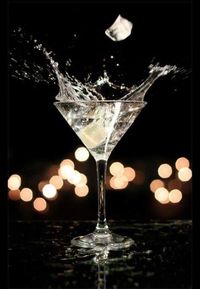 Close-up of wine glass against black background